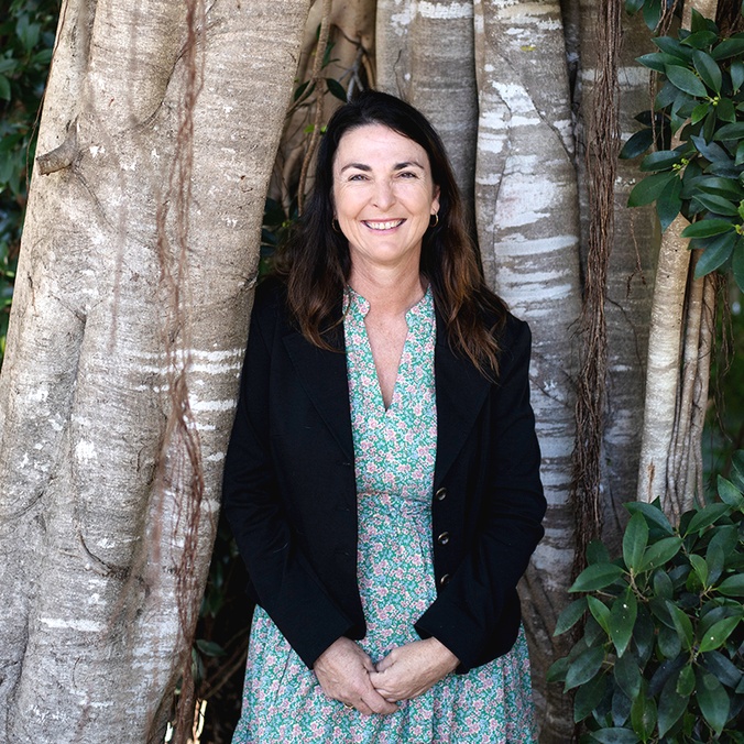 Indigenous Research Academic Kylie Day standing in from of a tree