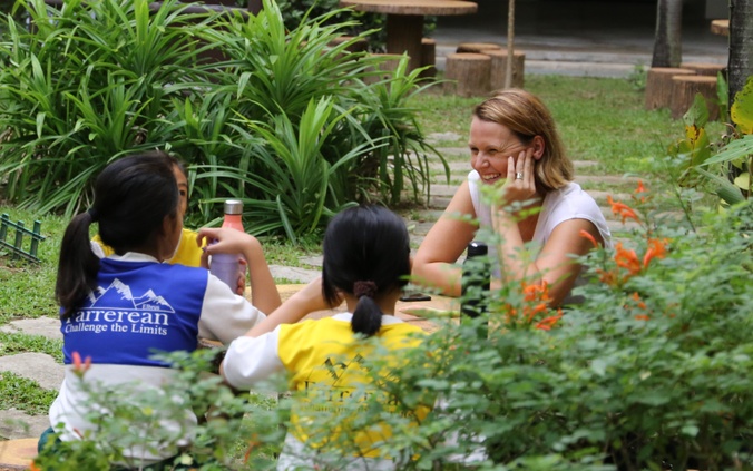 Photo of Dr Kate Neale in garden with children