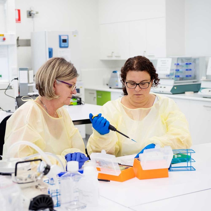 two female students in science lab