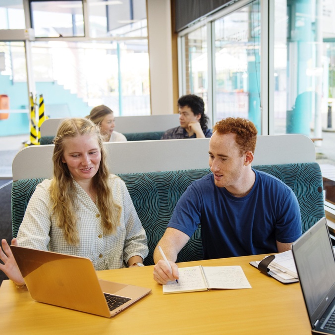 Students Sophie Cameron, Will McCallum, Luke Austin, interacting and using the Coffs Harbour campus library and Learning Centre facilities.