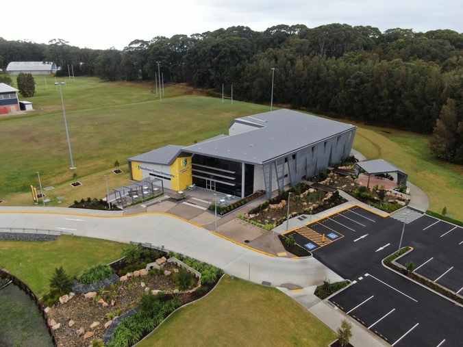 Birds eye view of a new building and carpark built for health sciences