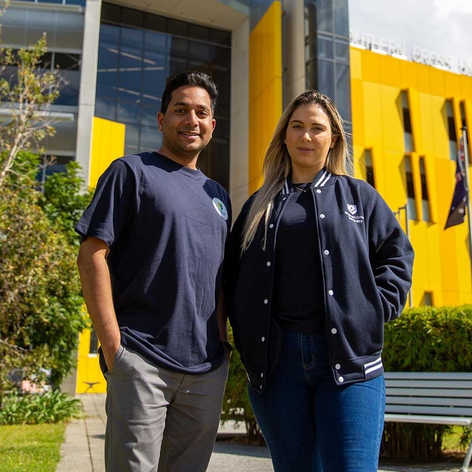 man and woman in front of building