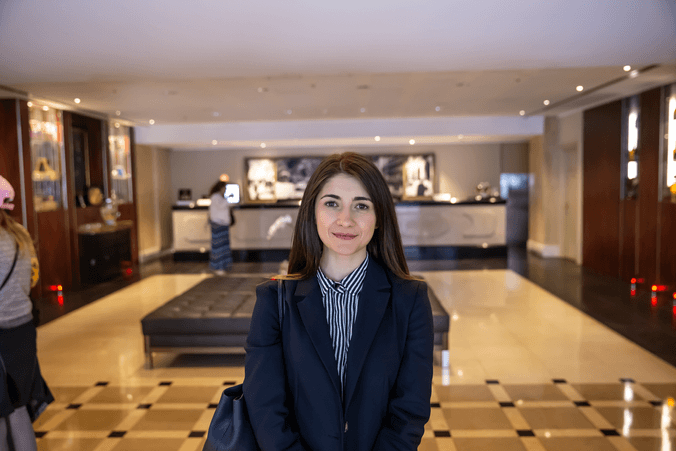 Female student portrait inside hotel lobby