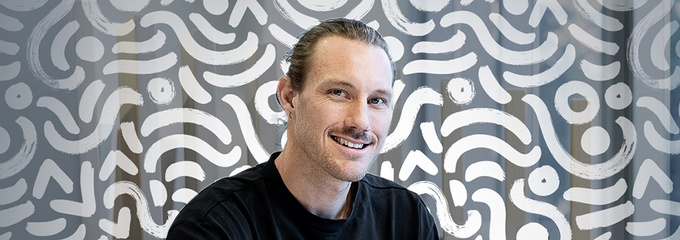 Man on his laptop with edited background