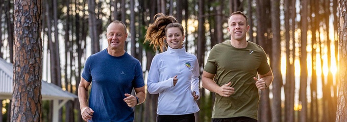 Isaac Hawkins and his family running through the park