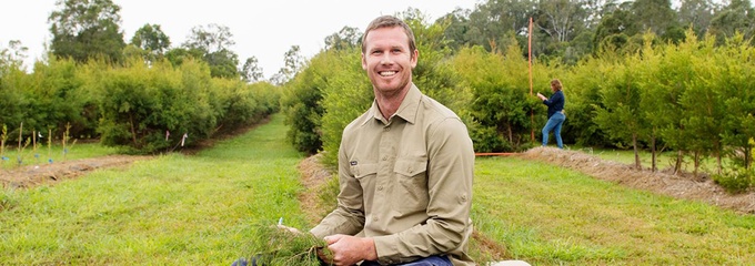 Man with his crops in his field on a farm