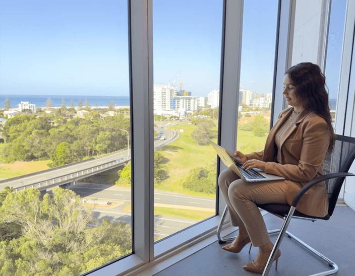 Dakota with her laptop on Gold Coast campus