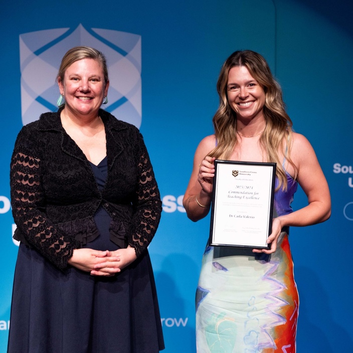 Dr Carla Velario accepting commendation for teaching excellence