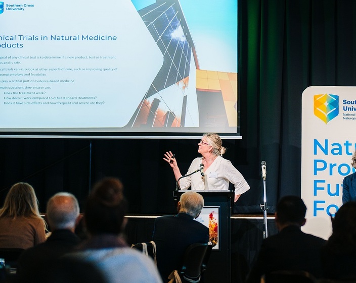 A woman giving a public lecture