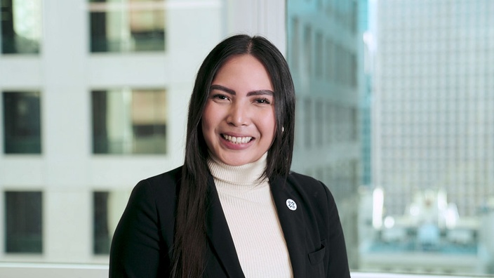 A woman smiling at the camera