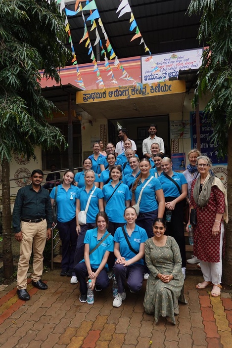 A group of students outside a medical facility in India