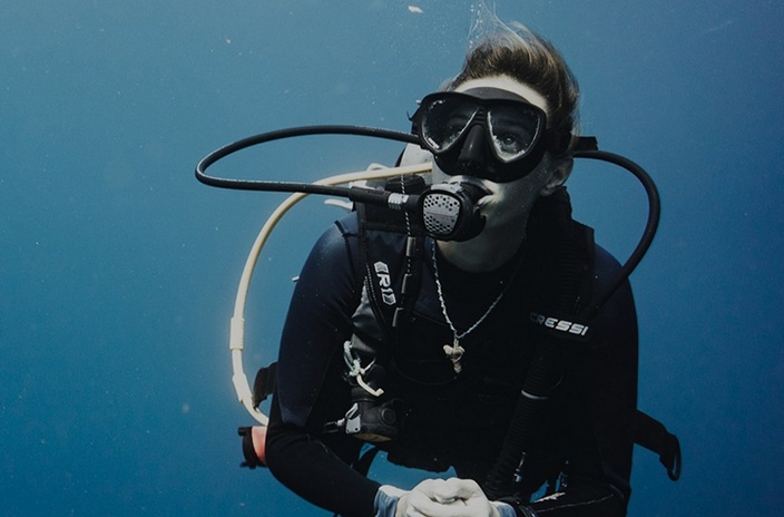 A person under the water scuba diving