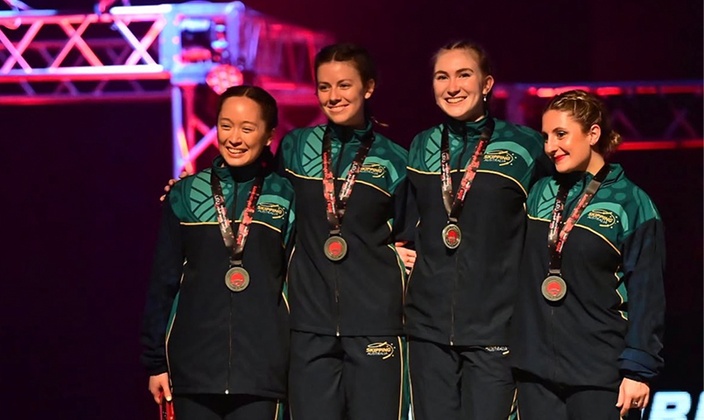 Group of women in tracksuits with medals
