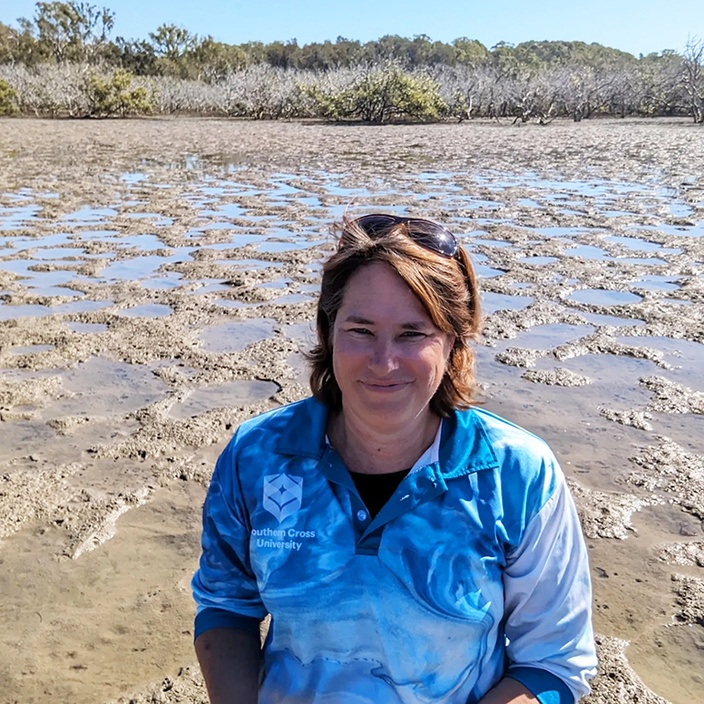 A woman at an estuary