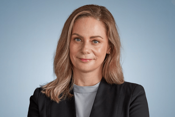 Headshot of woman in black blazer