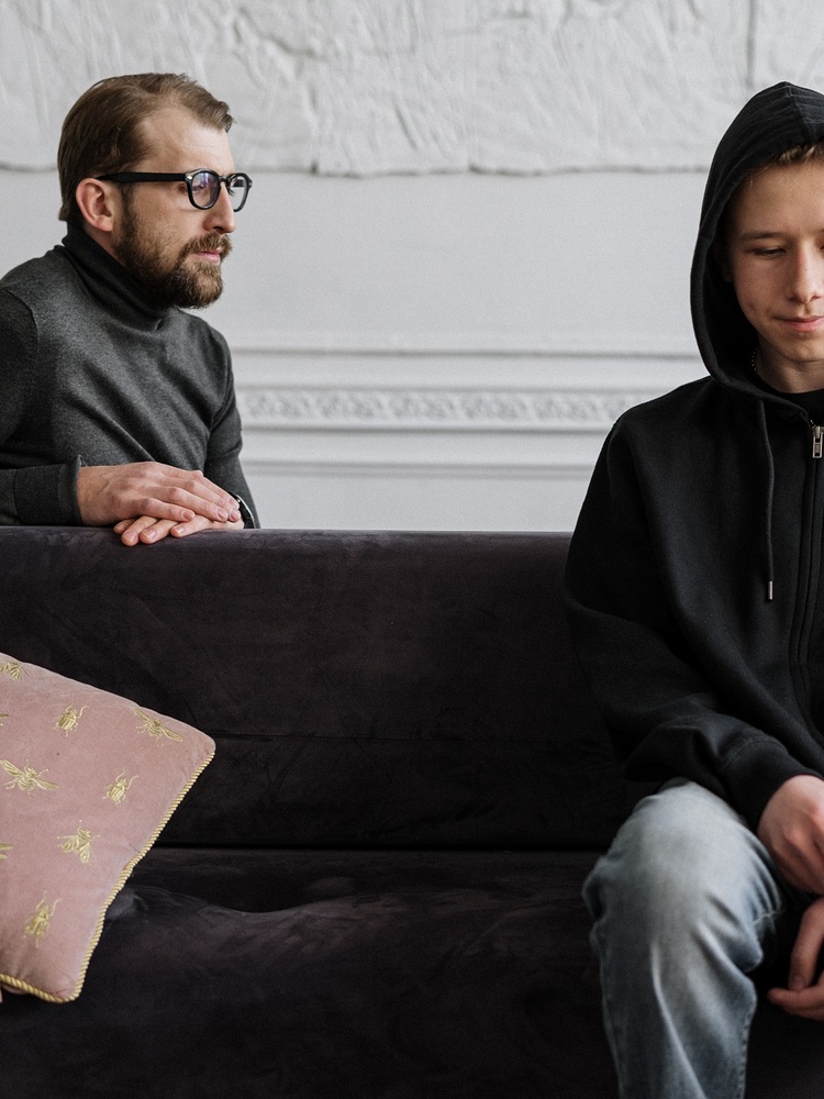 Man and young boy on a couch. Pexels/Cottonbro Studio
