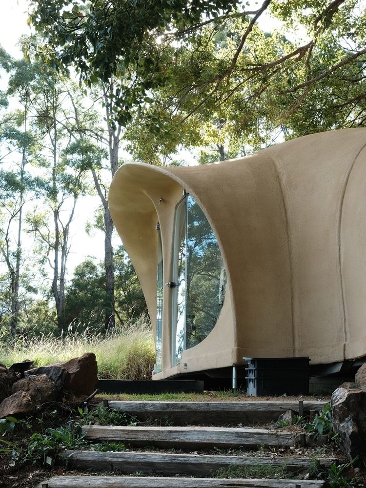 Organically shaped house in garden setting