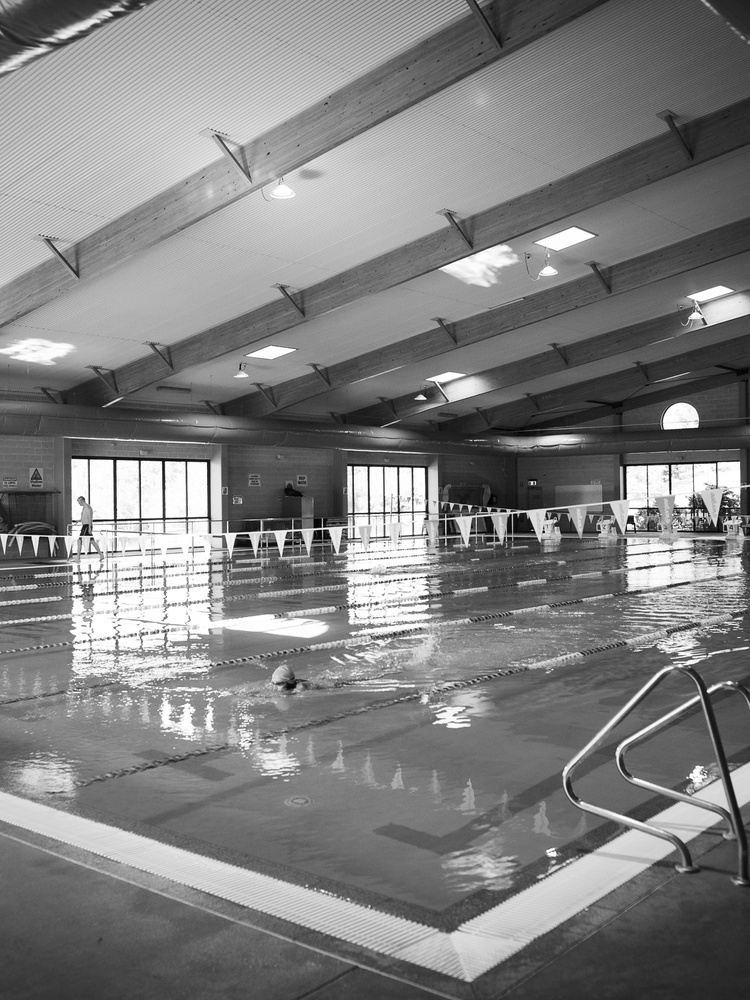 Image of large indoor pool from a corner
