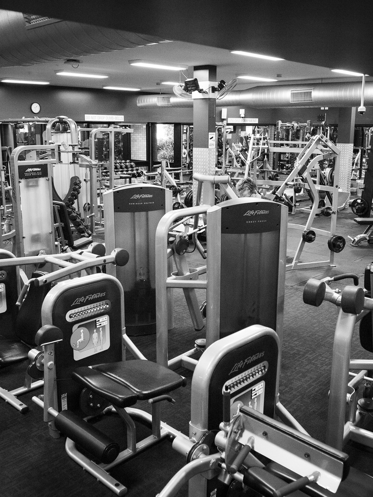 A room full of large gym equipment