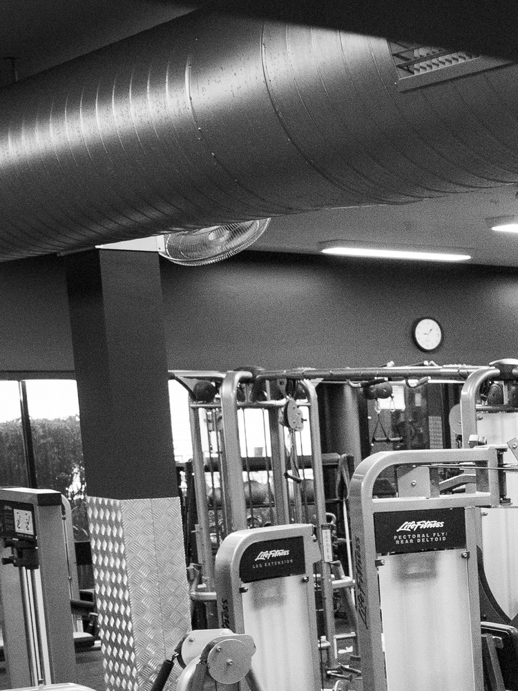 A room full of large gym equipment