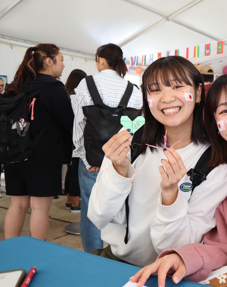two students smiling for camera