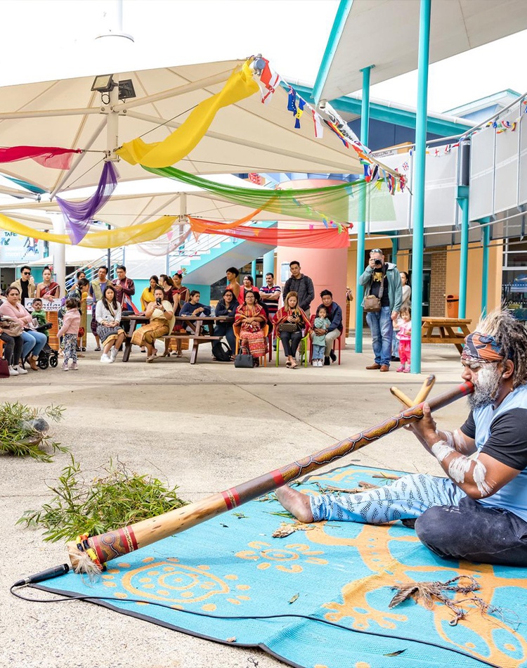 Elder playing didgeridoo