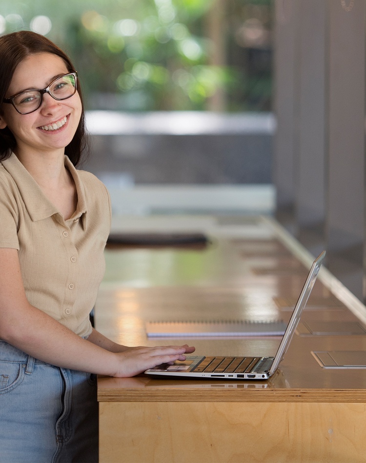 A student working at a standing desk