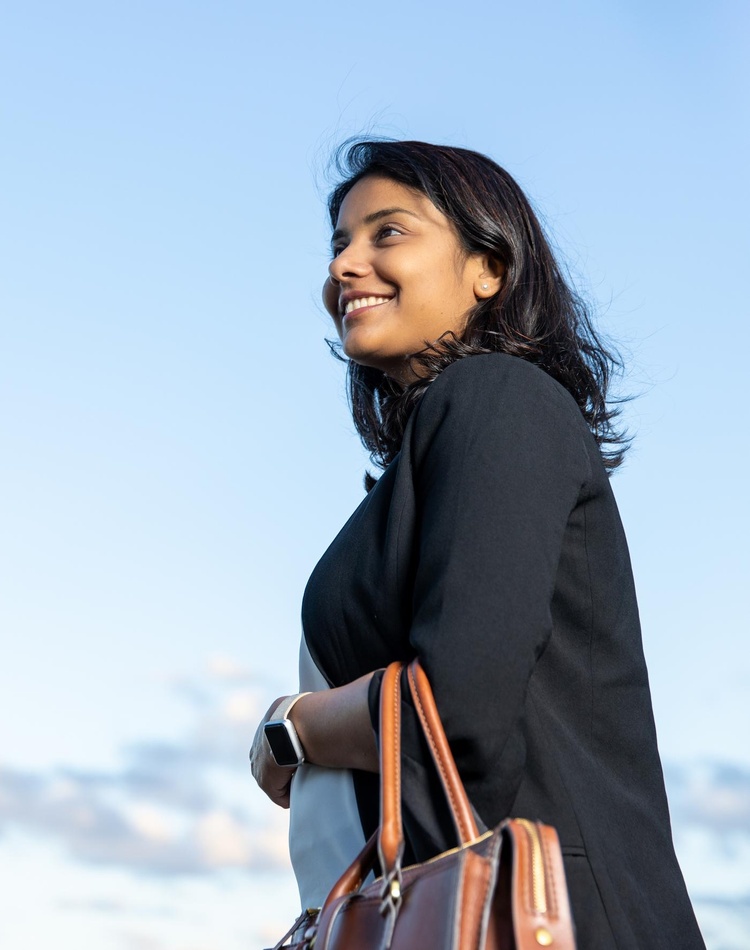 Student smiling and looking in the distance