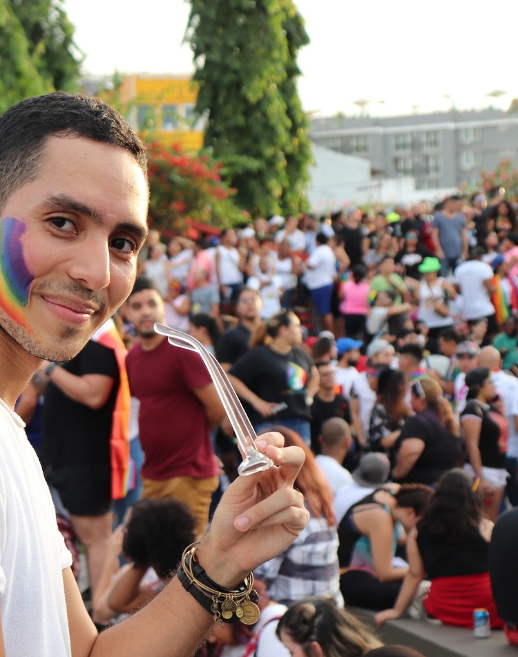 Person with rainbow painted on cheek