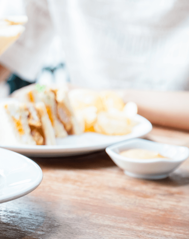 People eating sandwiches and salads