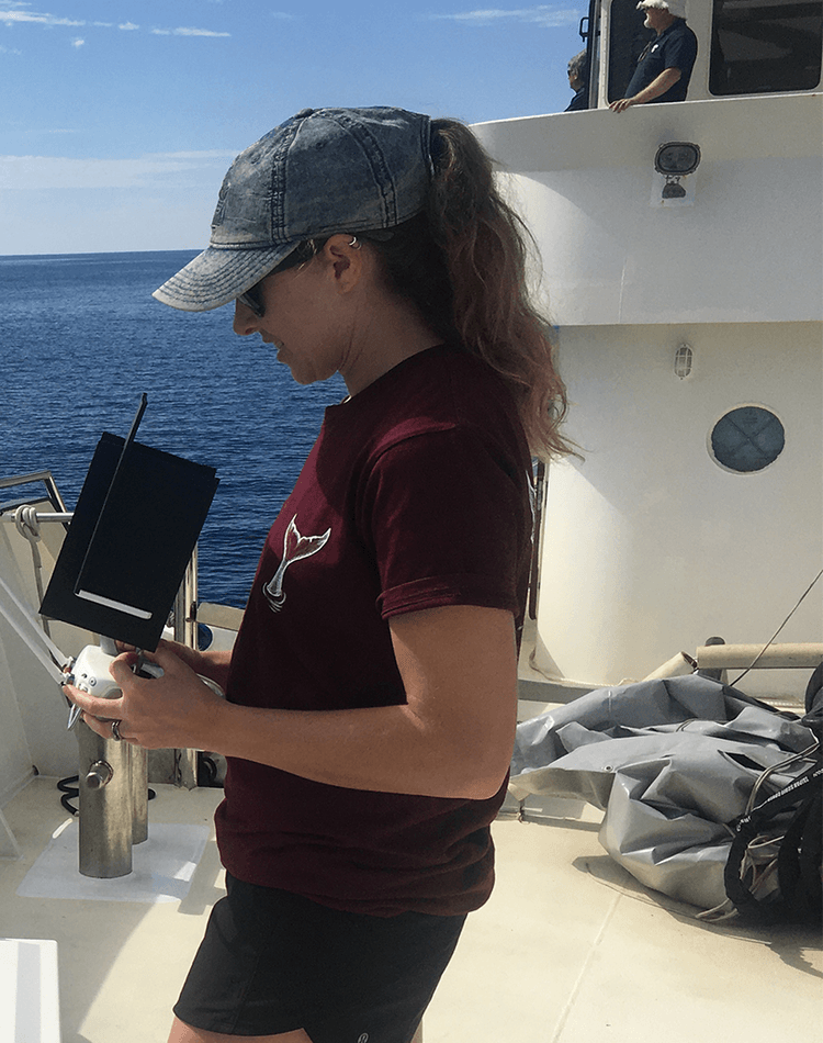 Woman on boat using drone