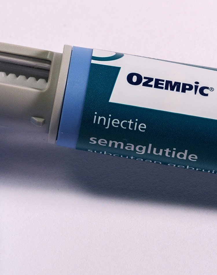 a-blue-and-white-medical-device-on-a-white-surface