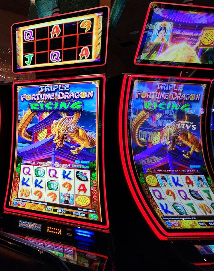 Casino room filled with lots of pokies