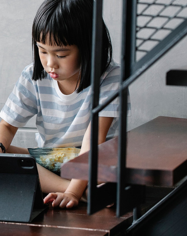 Two children using a digital tablet