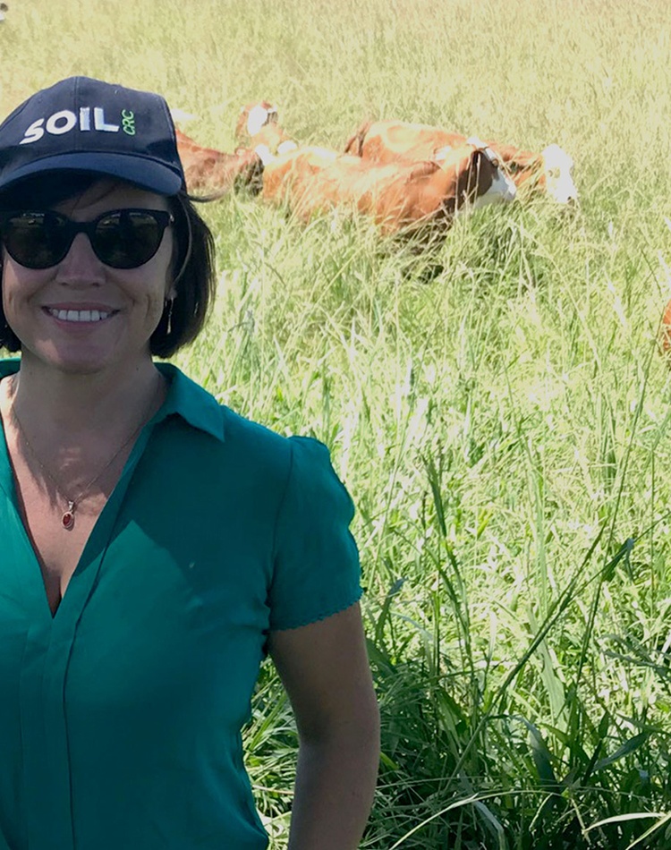 Hannabeth Luke in a field with cows