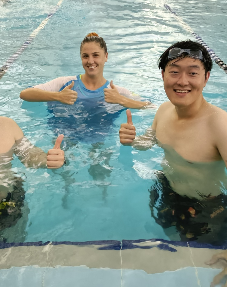 Students in water at learn to swim program