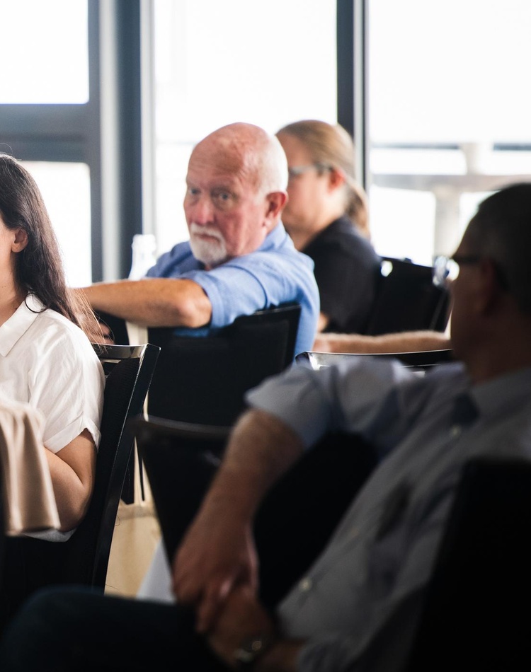 attendees sitting at event