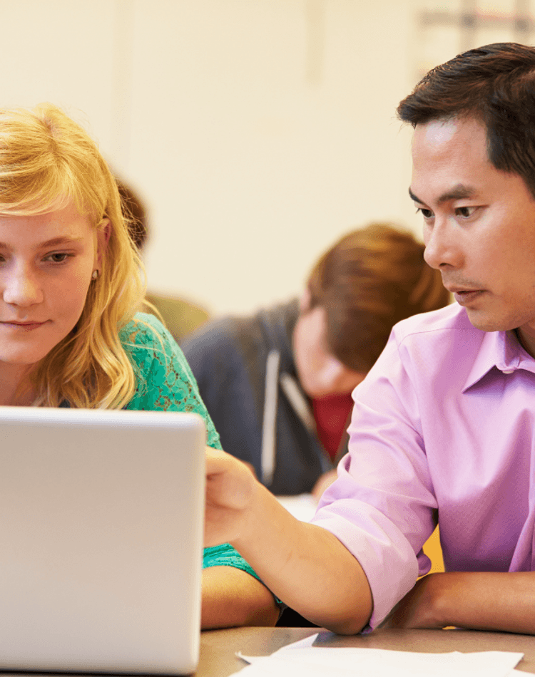 Two students on laptops studying, peer support, postgrad