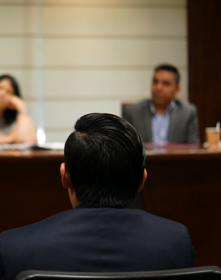 People sitting in a small court room