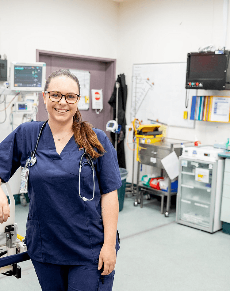 Emergency nurse and SCU graduate standing in the ward