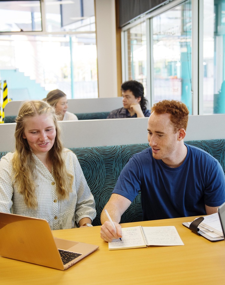 Students Sophie Cameron, Will McCallum, Luke Austin, interacting and using the Coffs Harbour campus library and Learning Centre facilities.