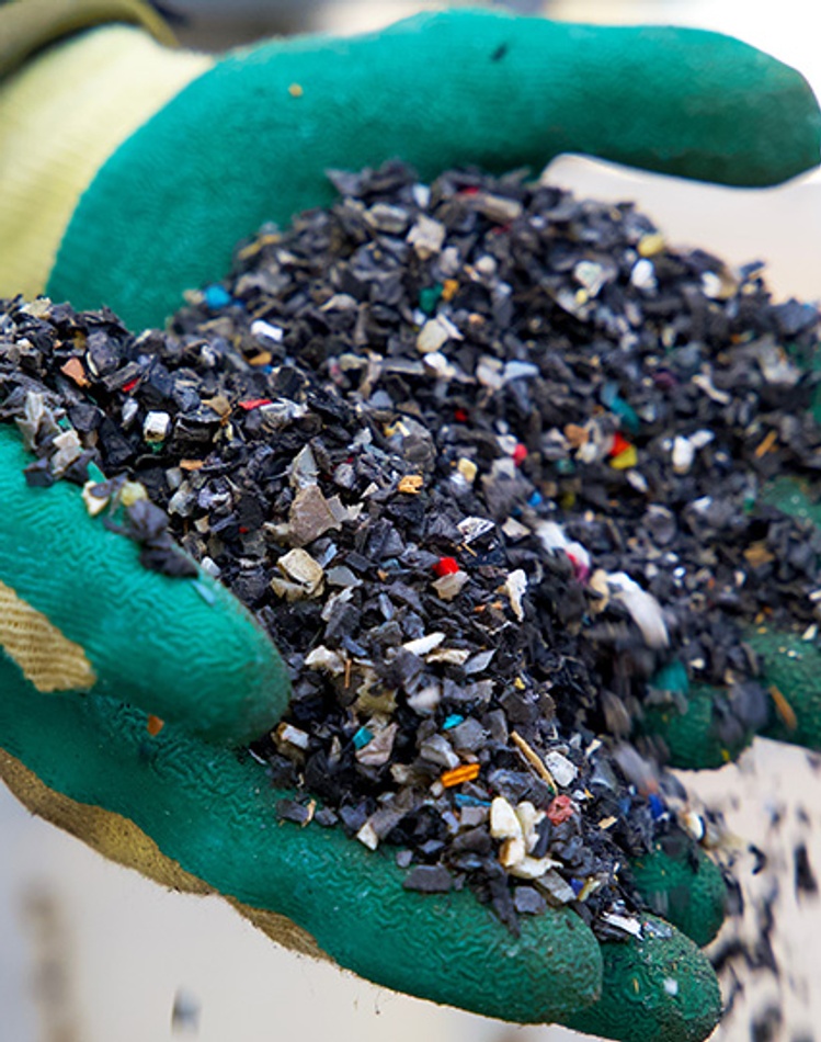 Waste Management in the Circular Economy - image shows plastic waste in gloved hand