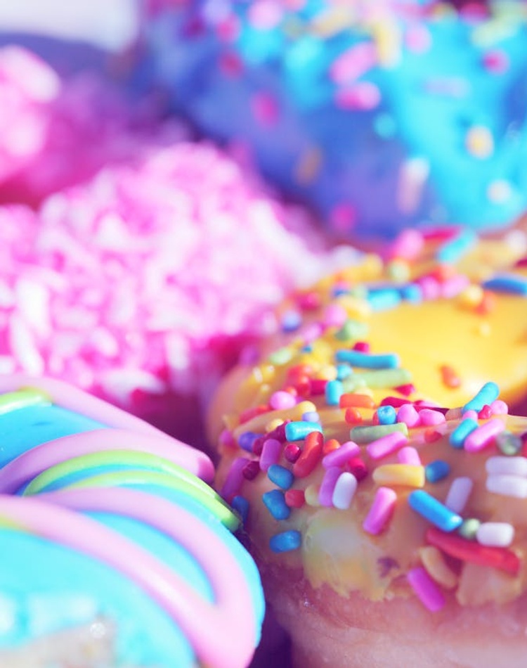 A close up of colourful donuts