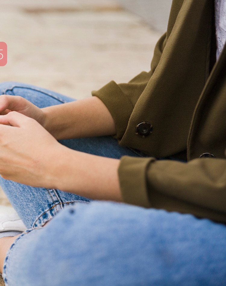 Young adult uses social media on mobile phone