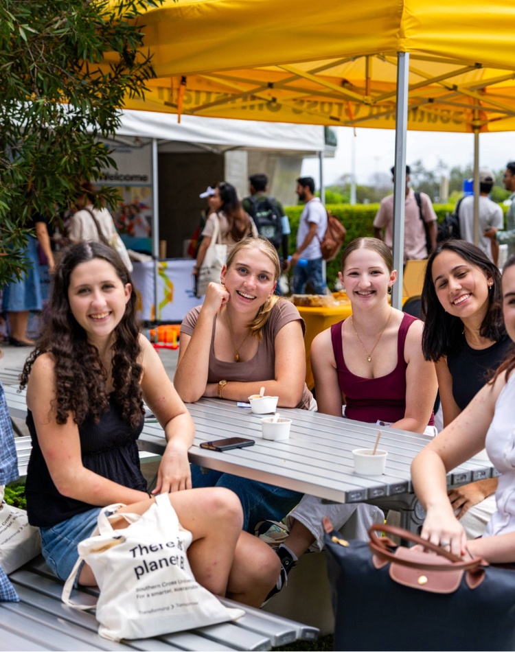 Gold Coast campus students sitting at a table