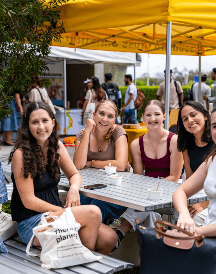 Gold Coast campus students sitting at a table