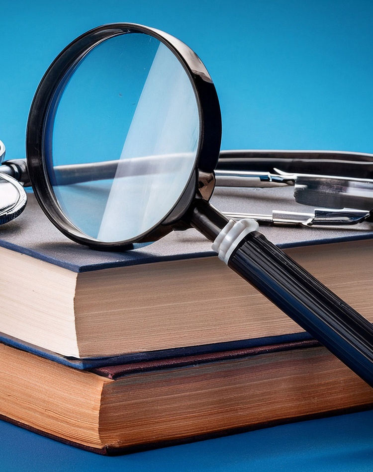 Health-text-books-with-magnifying-glass-and-stethoscope-right
