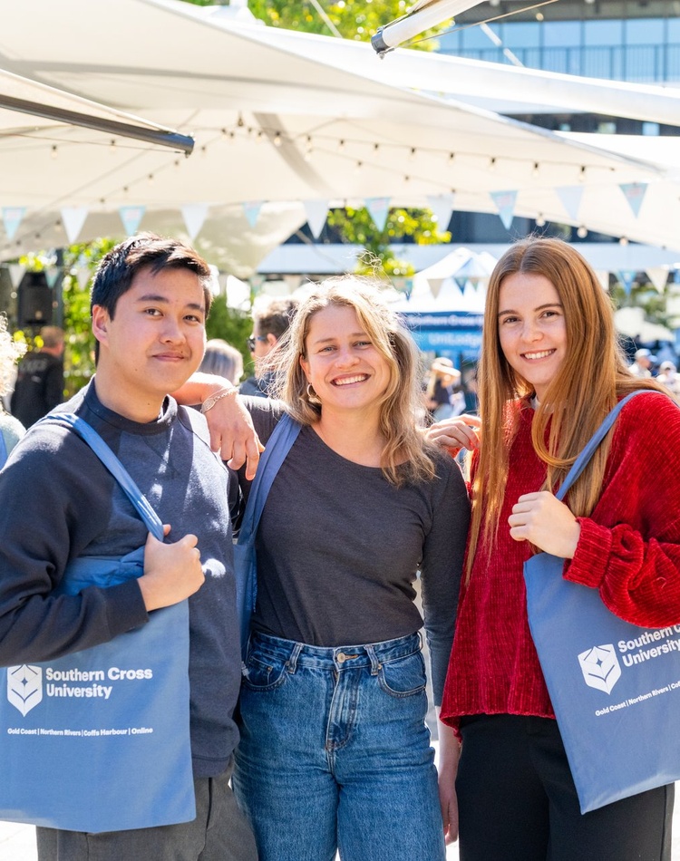 3 students at a university event