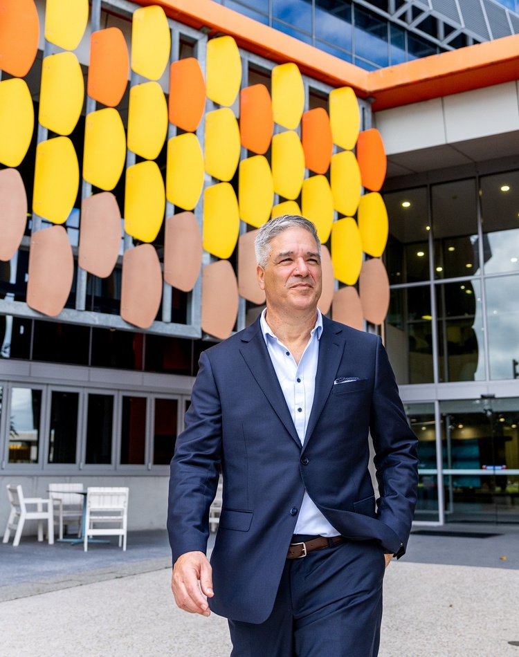 Dr Lewes Peddell walking through our Gold Coast Campus