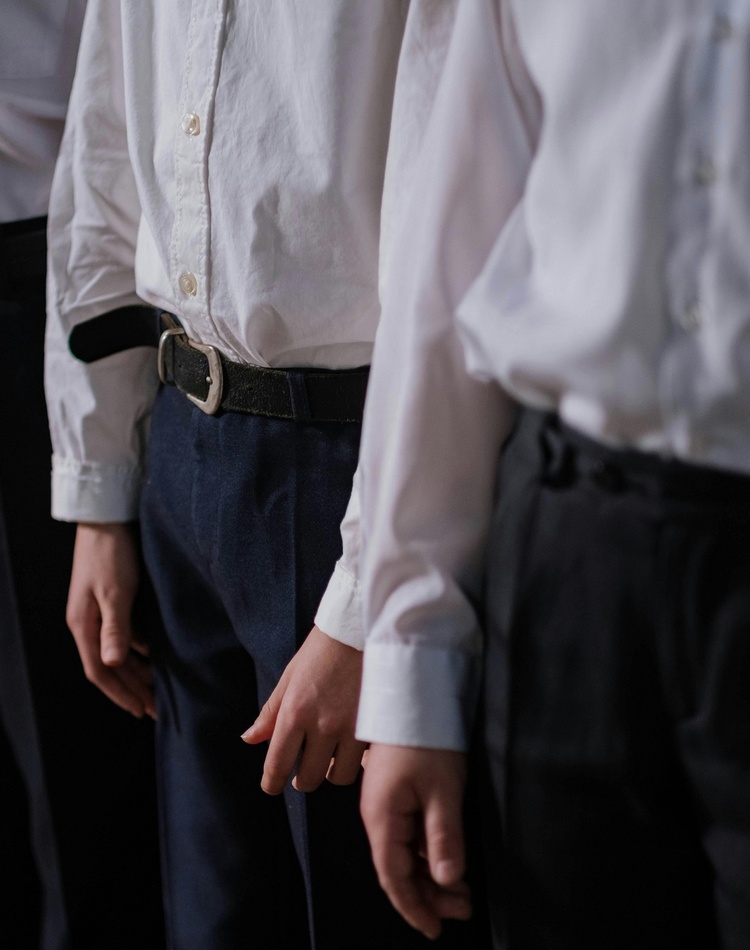 A row of students in shirt and trousers